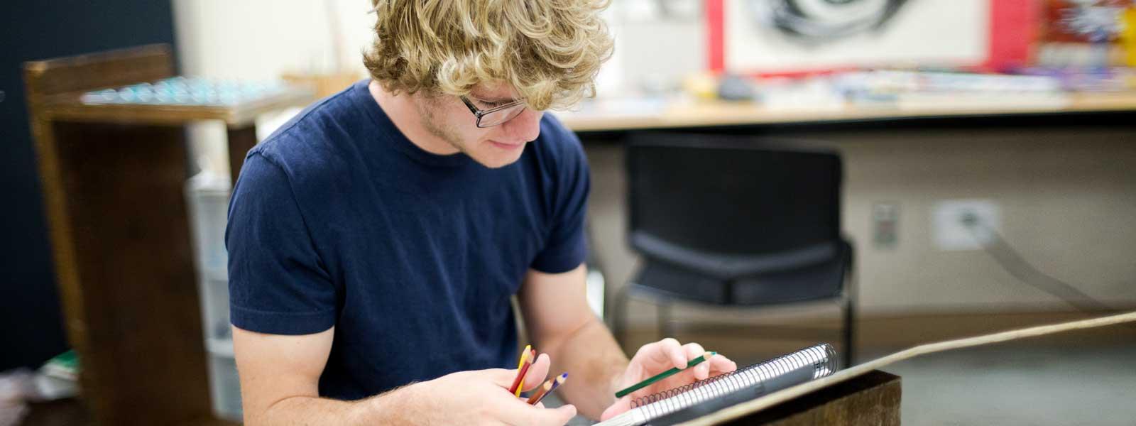 art student works on drawing project