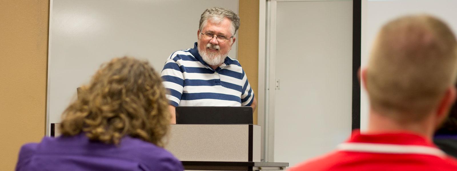 students listen to teacher lecture