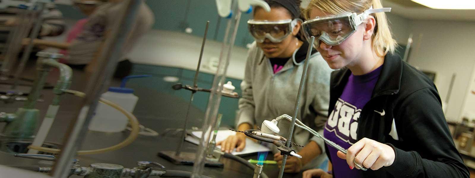 students work on chemistry experiment