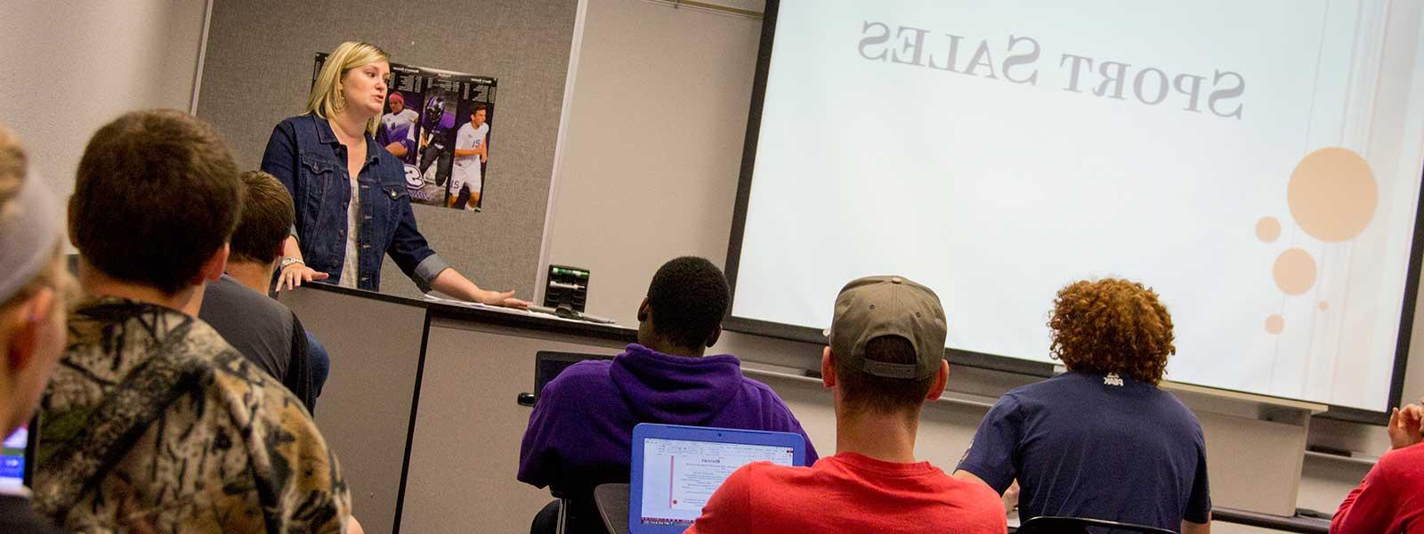 instructor giving presentation on sport sales