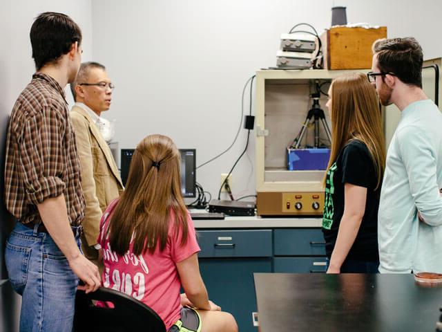 Professor and students in chemistry class