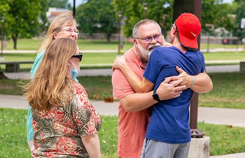 family hugging and visity Bolivar campus